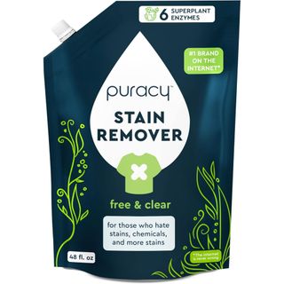 A blue, green and white bag of puracy stain remover