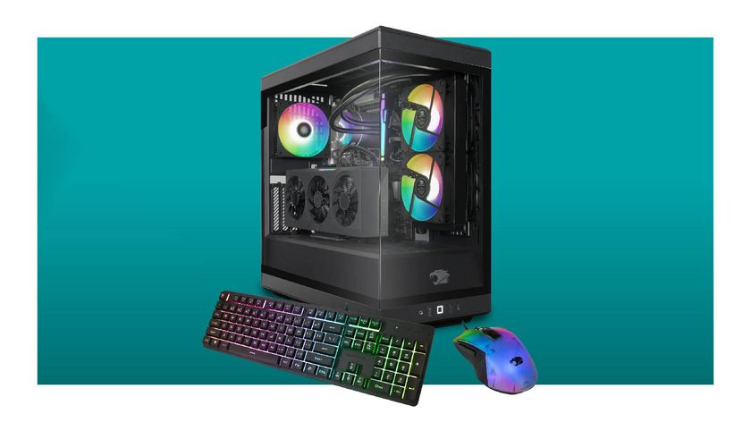 iBuyPower Y40 gaming PC with keyboard and mouse on a blue background