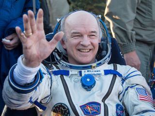 NASA astronaut Jeff Williams waves while resting in a chair shortly after he and Russian cosmonauts Alexey Ovchinin and Oleg Skripochka landed their Soyuz TMA-20M capsule in a remote area near the town of Zhezkazgan, Kazakhstan on Sept. 7, 2016 Kazakh time (Sept. 6 EDT). The trio spent 172 days in space living on the International Space Station.