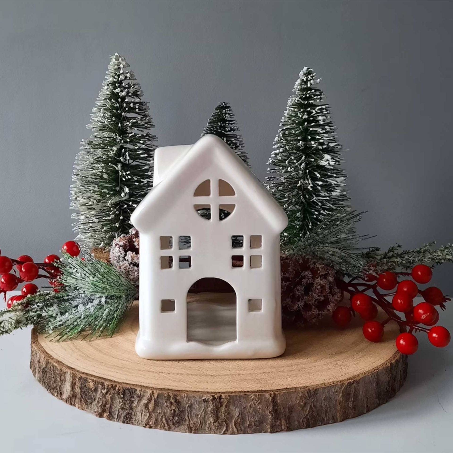 White ceramic tealight house to suggest how to style. guest bedroom