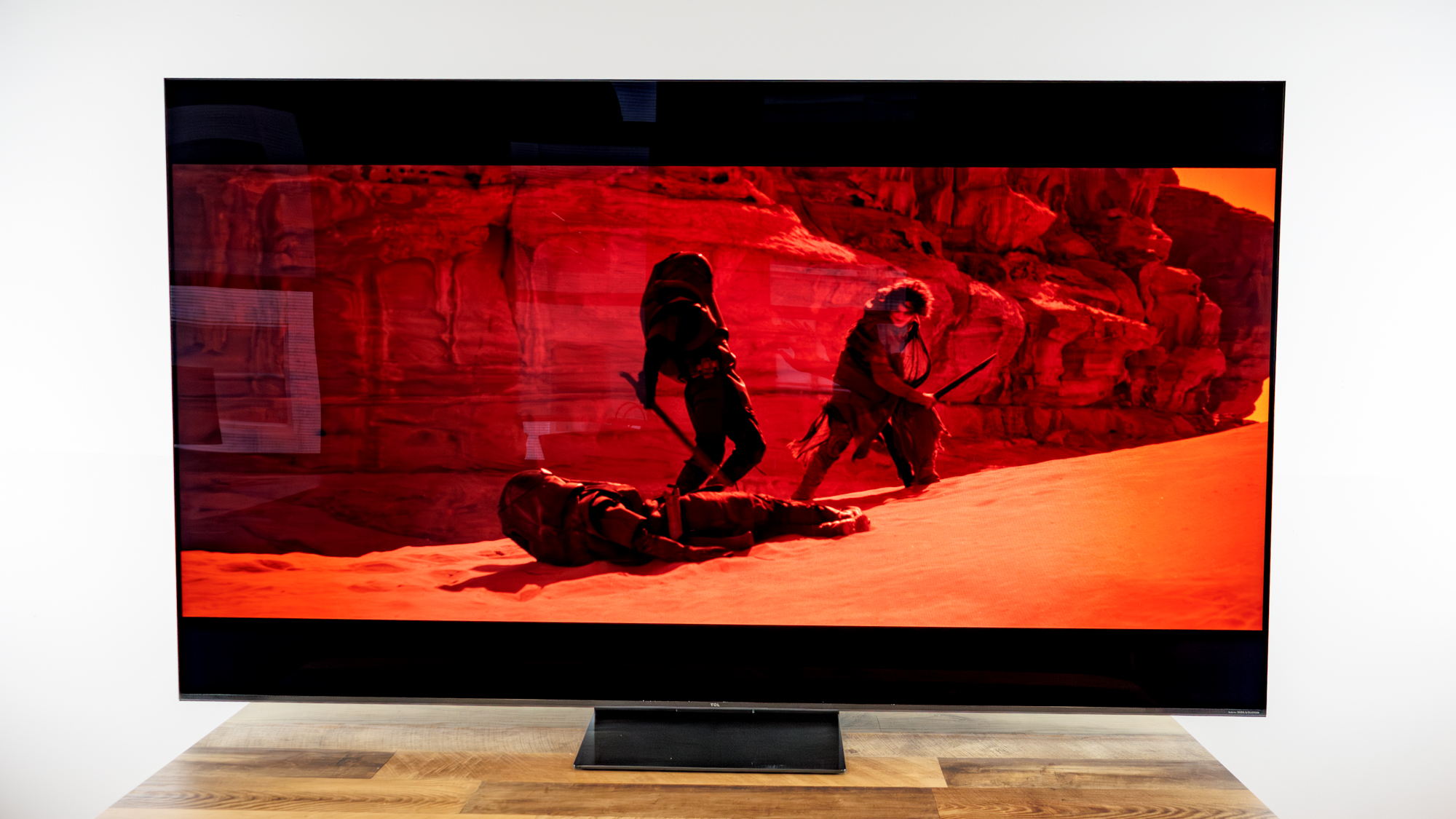 TCL QM7L 75-inch TV on a desk