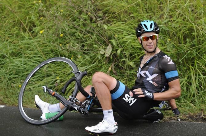 Richie Porte (Sky) comes to grief on the wet tarmac at the Clasica San Sebastian