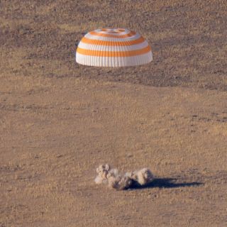 The Russian Soyuz MS-12 spacecraft carrying astronauts Nick Hague of NASA, Aleksey Ovchinn of Roscosmos and Hazzaa Ali AlMansoori of UAE approaches a landing from the International Space Station on the steppe of Kazakhstan on Oct. 3, 2019.