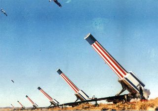 ’Bridge to Nowhere’ by Gabriele Garavaglia. A row of cannons aiming up with red, blue and white stripes on them.