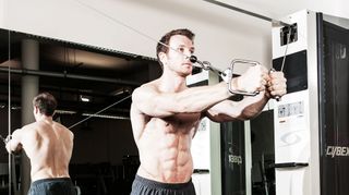 Man does cable flye chest exercise
