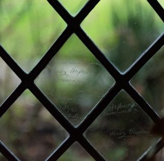 signatures dating back to 1672 etched into glass of Elizabethan manor - Britain's oldest home