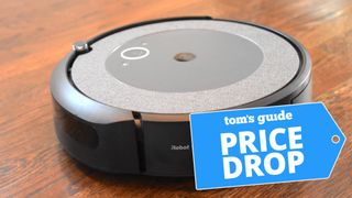 Roomba i3 shown cleaning wood floor