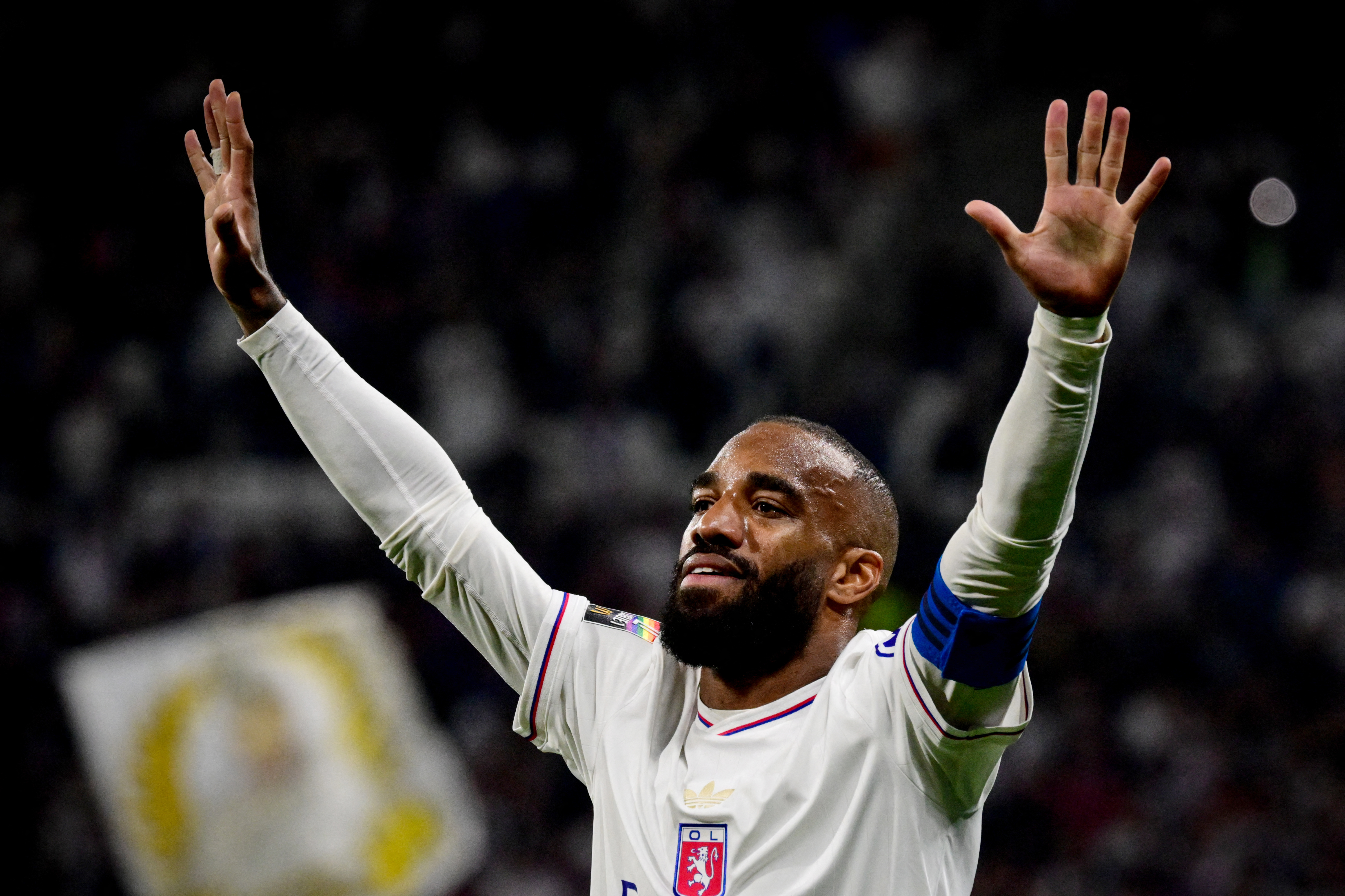 Alexandre Lacazette salutes the Lyon fans after scoring for the club on his final appearance, against Angers, in May 2025.