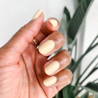 Short oval nails with pastel yellow nail polish