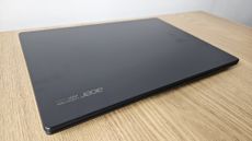 The Acer TravelMate P6 14 AI on a desk