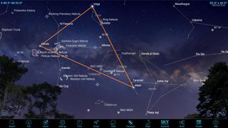 The Summer Triangle — which consists of the three bright stars Deneb, Vega and Altair — is visible from late spring until winter, but it's highest in the sky during the summer months. Use binoculars to scan the many objects in the Milky Way and to spot the small Coathangar asterism.