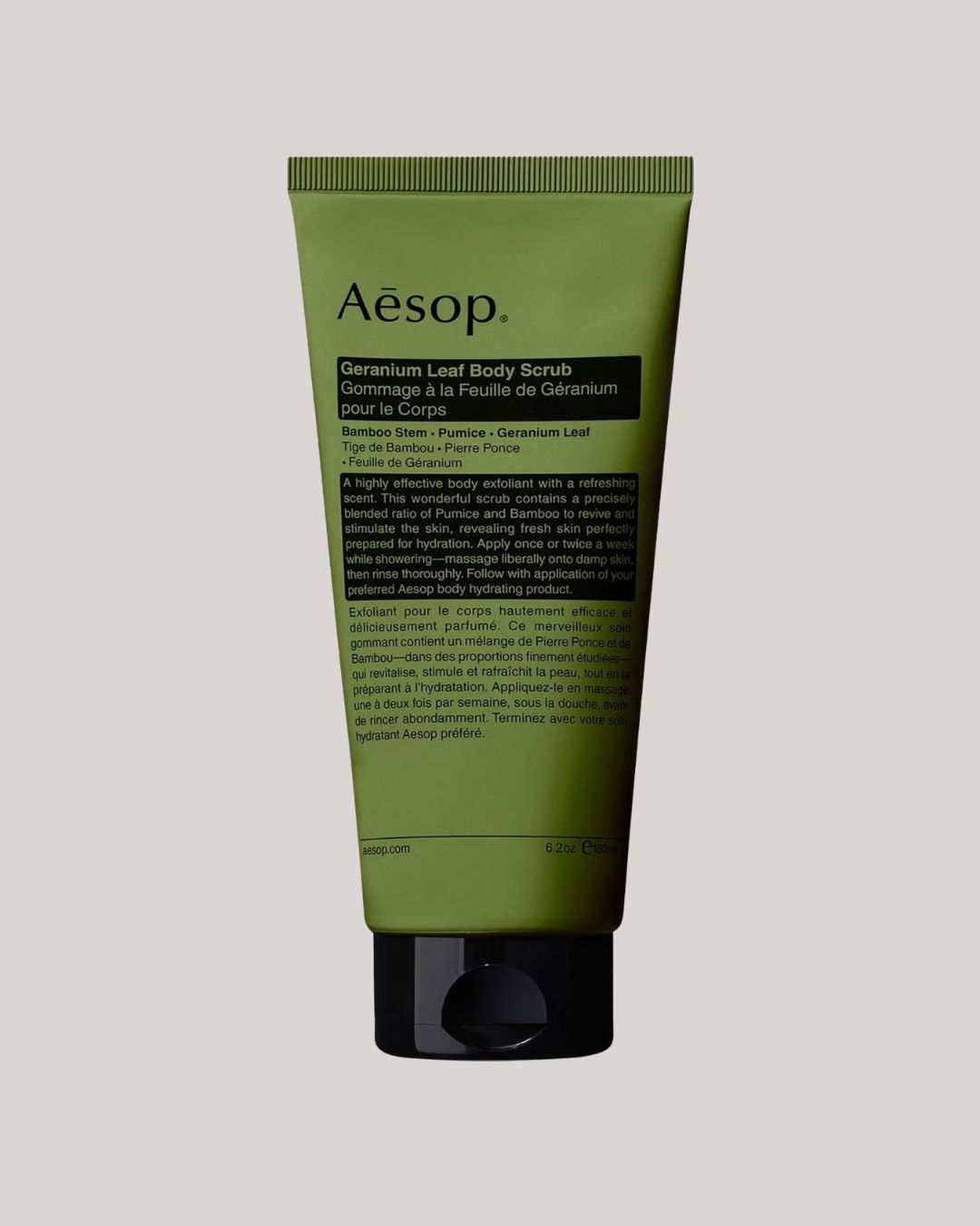 Geranium Leaf Body Scrub 180ml against pale gray background.