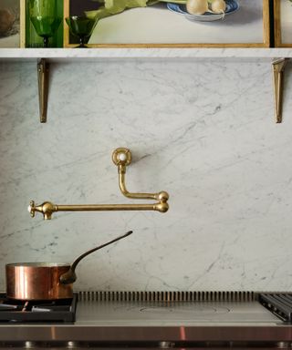 Pot filler taps trend, brassy colored tap by deVOL in marble kitchen