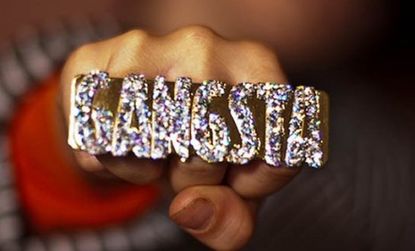 A teenager shows off his "Gangsta" bling: At a Minnesota high school, white students reportedly treated a dress-up day during spirit week as an opportunity to wear clothes that they believed 