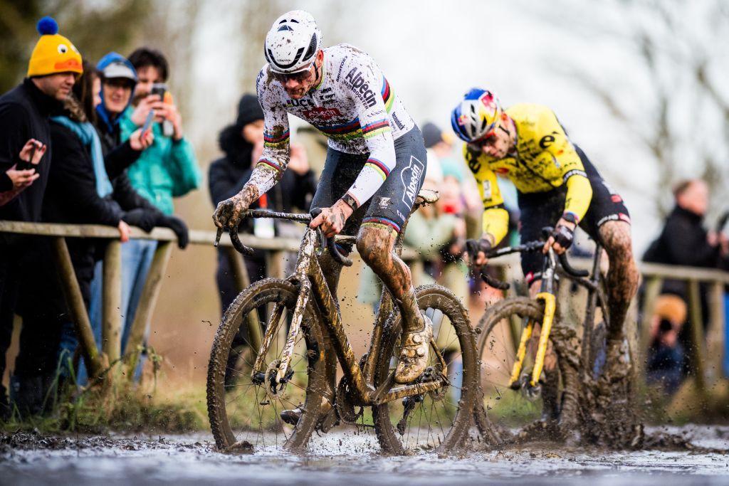 Dutch Mathieu Van Der Poel (L) and Belgian Wout van Aert compete during the men's elite race of the 'GP Sven Nys' cyclocross cycling event, stage 4 out of 8 of the X2O Badkamers 'Trofee Veldrijden' competition, in Baal on January 1, 2024. (Photo by JASPER JACOBS / Belga / AFP) / Belgium OUT