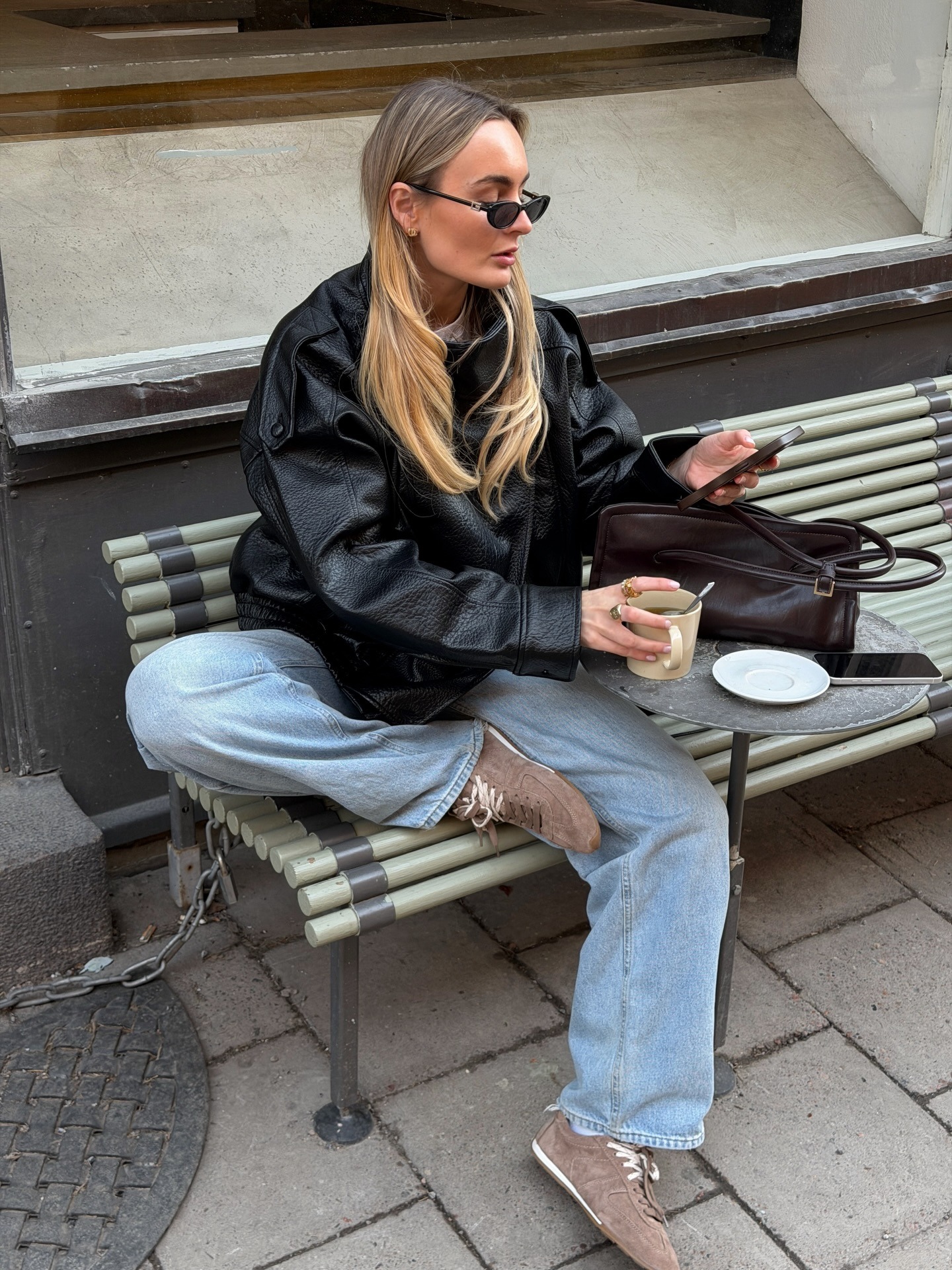 Woman wearing wide leg jeans with spring 2026 shoe trend.
