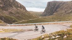 Two riders on the Bealach na Ba, Scotland