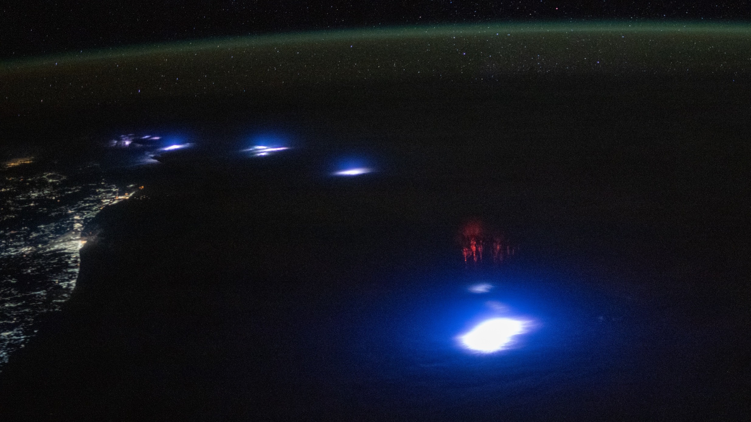 Sprites from space! Astronaut photographs rare red lightning phenomenon from ISS Space