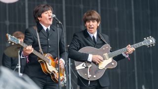 Steve White (Paul McCartney) and Stephen Hill (George Harrison) of The Bootleg Beatles perform on stage on the first day of the TRNSMT Festival at Glasgow Green on July 08, 2022 in Glasgow, Scotland.