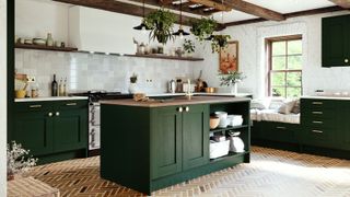 green kitchen with brick floor