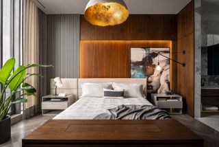 a modern bedroom with slatted wall paneling