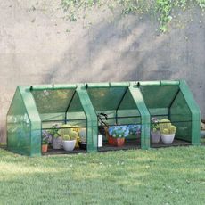 Outsunny greenhouse with the walls rolled up and plants inside