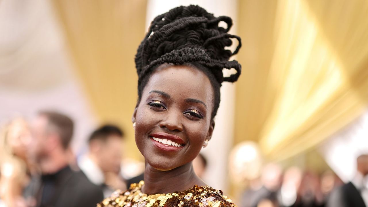 lupita nyong&#039;o on a yellow background