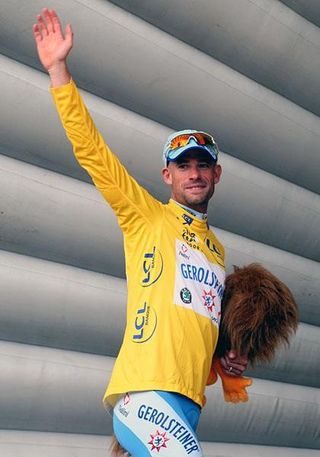 Schumacher waves to the crowd and walks off with the lion firmly in his hands.
