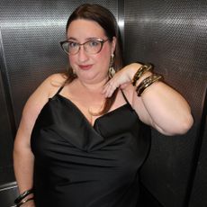 Sarah Chiwaya wearing a little black dress with mixed metal jewelry