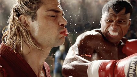 Balrog (50 Cent) knocks Ken Masters (Centineo) out with a bloody punch in Street Fighter (2026).