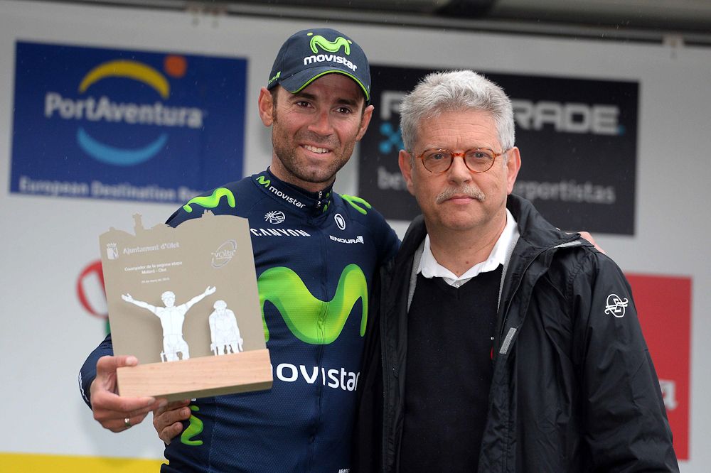 Stage winner Alejandro Valverde collects his trophy.