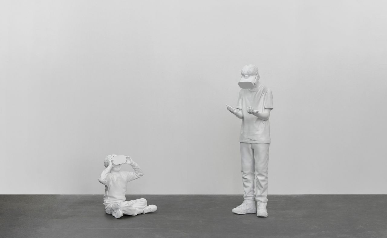 white sculptures of people