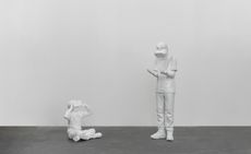 white sculptures of people