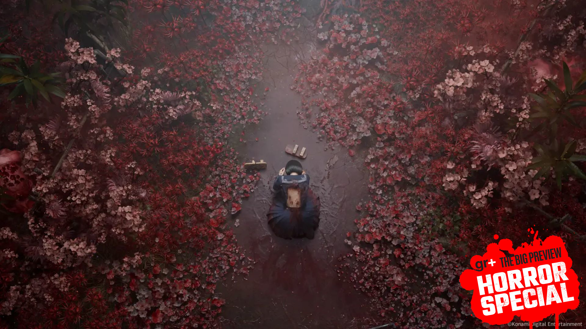 A top down view of a schoolgirl on the floor surrounded by blood-red leaves in Silent Hill f