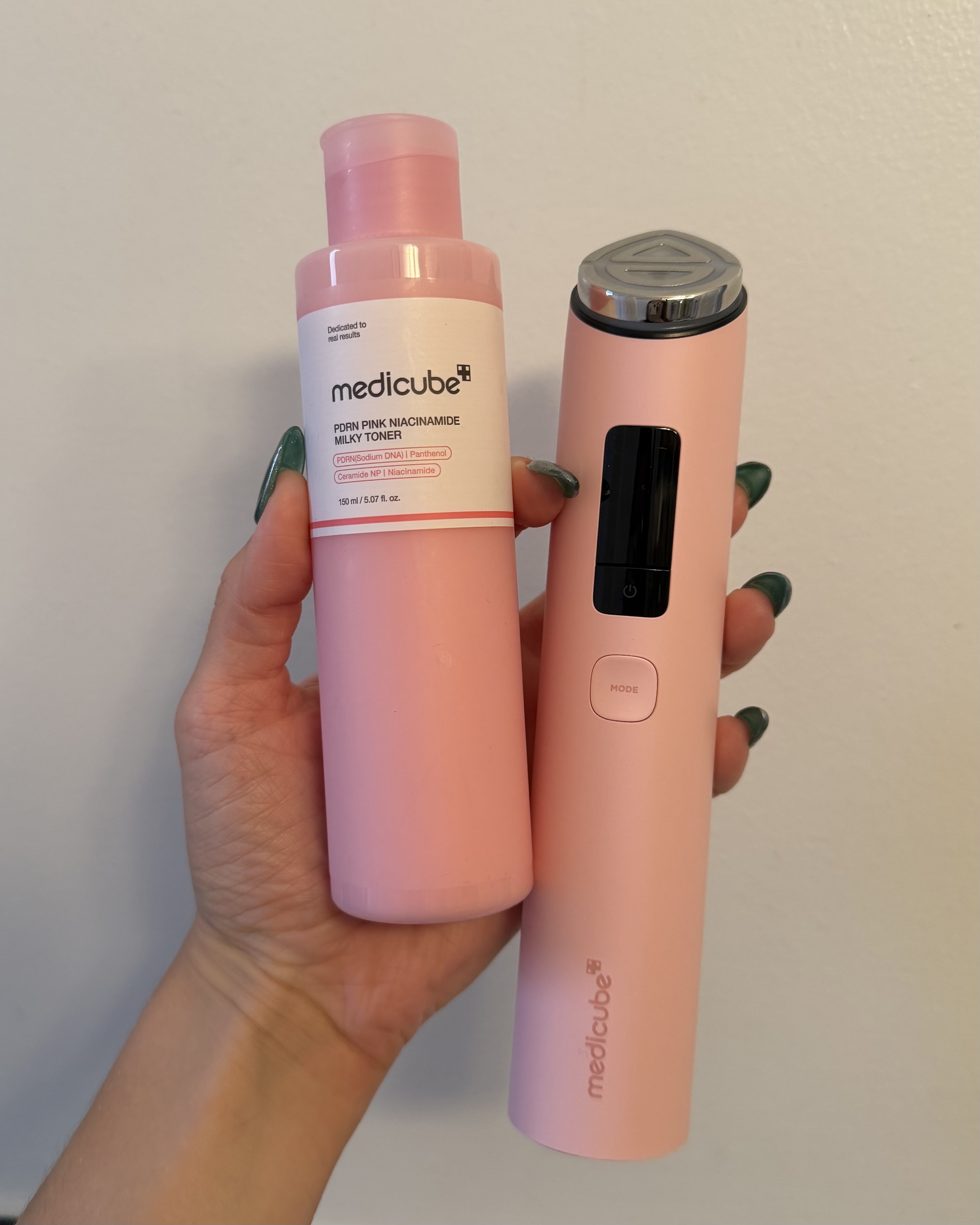 An image of Who What Wear associate beauty editor Alyssa Brascia holding the Medicube PDRN Pink Niacinamide Milky Toner and Booster Pro.