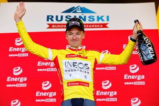 Ethan Hayter (Ineos) on the podium of the race leader at Tour de Pologne 