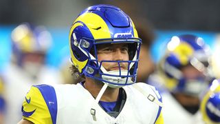 Matthew Stafford, wearing the colors of the LA Rams, wearing a helmet.