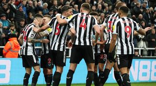 Newcastle players celebrate Miguel Almiron's winner against Wolves at St James' Park in the Premier League in March 2023.