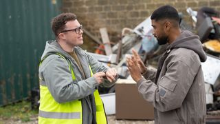 Vinny in hi-vis vest in animated conversation with Kammy