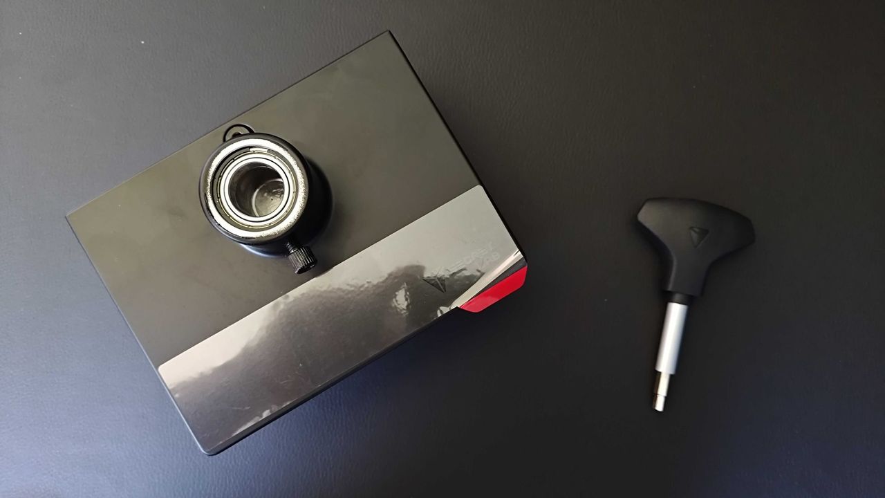 Secretlab Heavy Duty Monitor arm base and hex screwdriver sitting on Magnus Pro desk