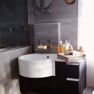 bathroom with grey wall and wash basin