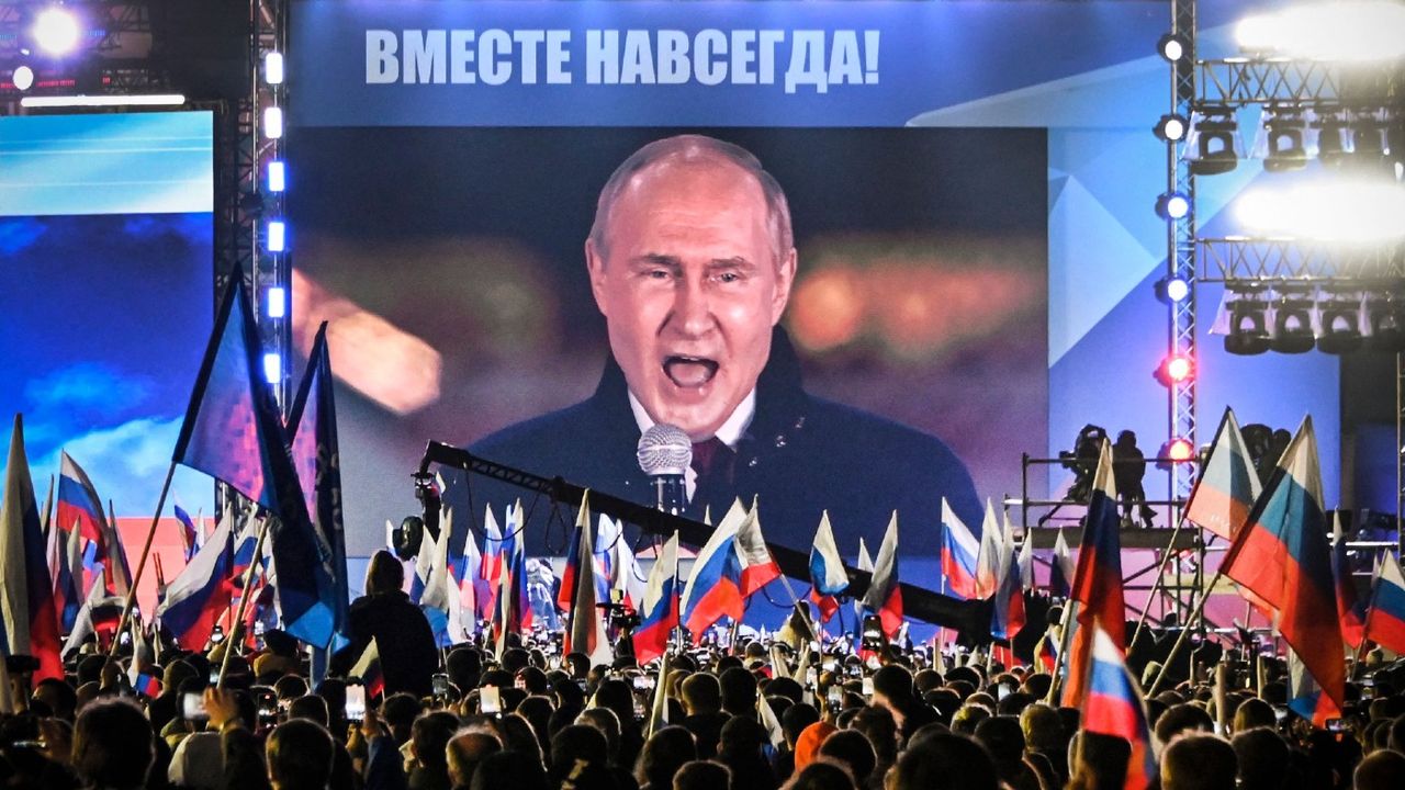 Putin is seen on stage