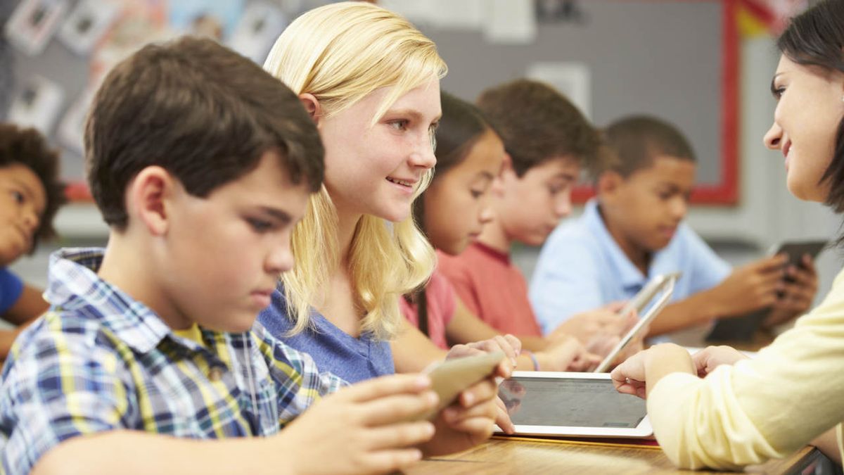 Teacher and kids with tablet computers