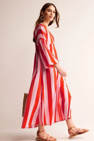 woman wearing red and pink striped dress