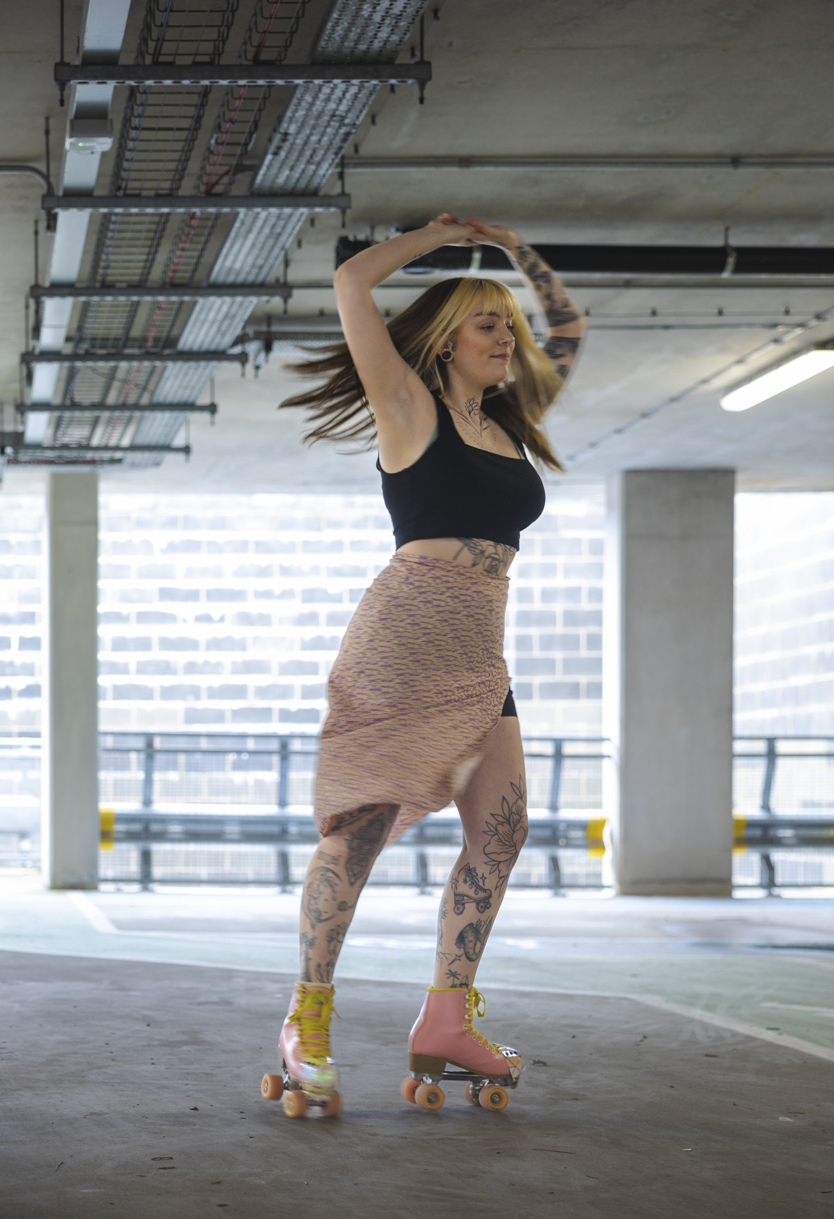 Canon EOS R8 sample image of a rollerskater in action dark lighting