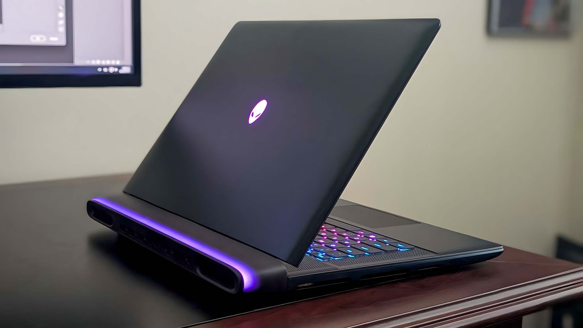 Alienware Area-51 16 Gaming Laptop facing away to give a view of the RGB thermal shelf and Alienware icon on back.