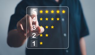 A user touching a virtual screen to give a five star rating