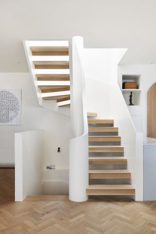 Modern staircase with curved solid bannisters