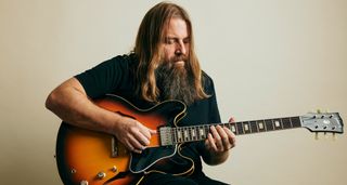 Mark Morton of Lamb of God photographed at home with a Gibson ES-335