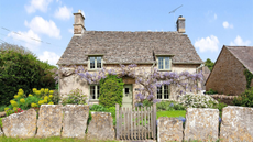 Cotswold cottage with wisteria growing outside